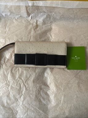 kate spade cream and black bow wristlet clutch